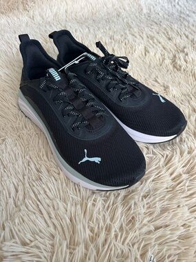 Puma Women’s Black Sneakers with White Sole and Mint Accents